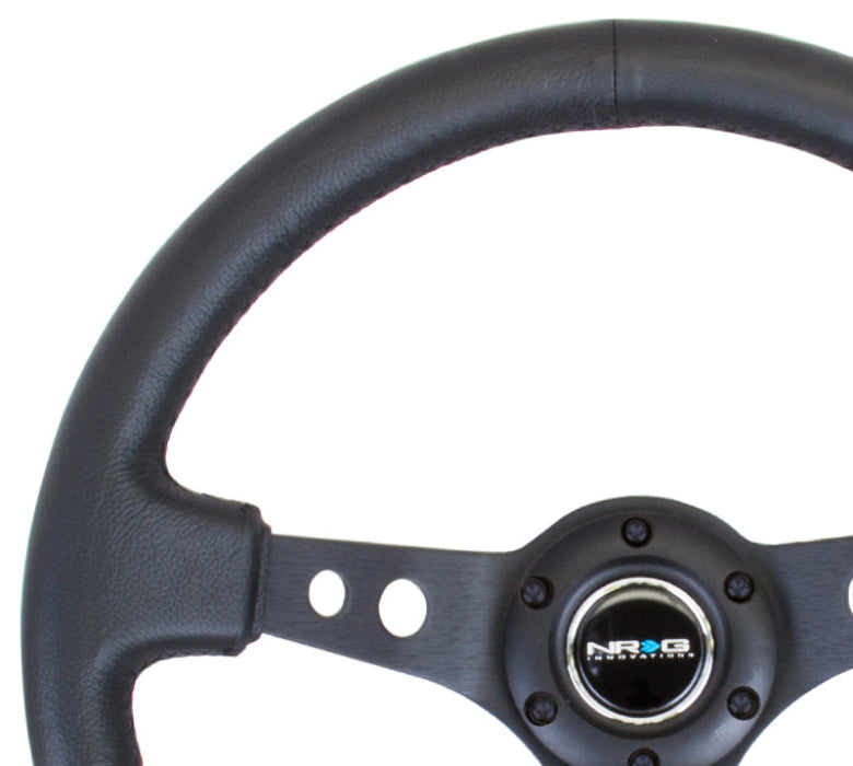 NRG Reinforced Steering Wheel (350mm / 3in. Deep) Blk Leather w/Blk Spoke & Circle Cutouts - Premium Steering Wheels from NRG - Just $134! Shop now at WinWithDom INC. - DomTuned